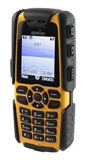 Front view of yellow and black Sonim XP3 Enduro showing physical keypad and color screen with signal, battery, Menu, and Contacts.