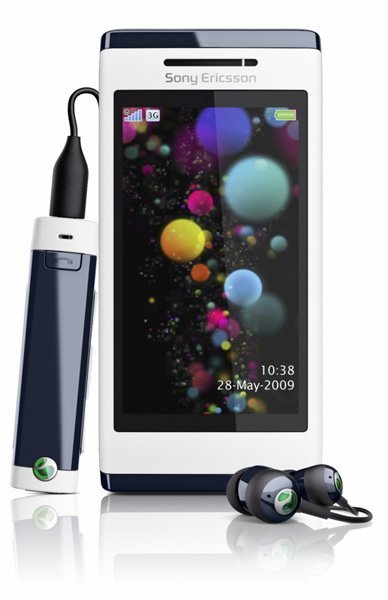 Sony Ericsson Aino front view with colorful spheres on screen, shown with included earbuds and charging cable