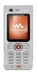 Front view of a silver Sony Ericsson W880i showing the Walkman logo on screen, circular nav button, and numeric keypad.