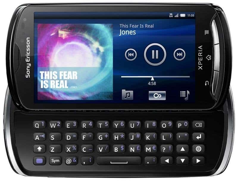 Sony Ericsson Xperia Pro front view with slide-out QWERTY keyboard, displaying music player with album artwork on screen