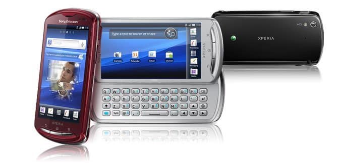 Sony Ericsson Xperia Pro shown in three views: red model with screen on left, silver model with slide-out QWERTY keyboard in center, black model on right