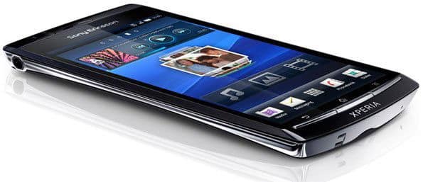 Sony Ericsson Xperia arc smartphone, front angled view, displaying blue home screen with app icons