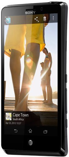 Sony Xperia TL front view displaying a photo of people on a beach at sunset on its screen