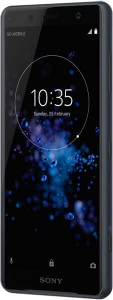 Black Sony Xperia XZ2 Compact, front angled view, screen on showing 10:35, Feb 25, with blue bubble wallpaper.