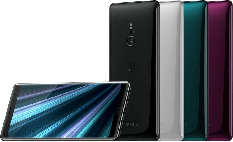 Sony Xperia XZ3 displayed from front and rear angles, showing screen with blue streaked wallpaper and four color variants: black, silver, teal, and burgundy
