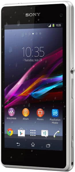 Front view of black Sony Xperia Z1 Compact showing home screen at 10:35, app icons, and water droplets on display.