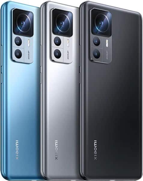 Rear view of three Xiaomi phones, including the 12T Pro, in blue, silver, and black with dual-lens camera modules and flash.
