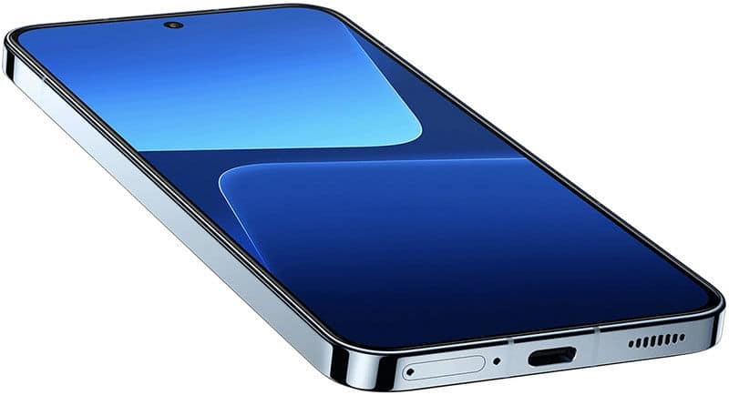 Xiaomi 13 front view, displaying blue interface on screen with small camera notch, silver frame, and side buttons visible