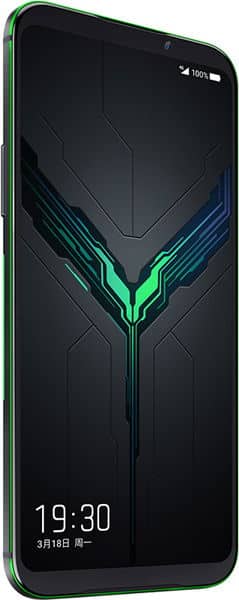 Xiaomi Black Shark 2 front display showing glowing green and blue geometric design on dark screen, with green frame edge visible