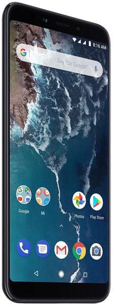Xiaomi Mi A2 front view, black, displaying home screen with Google search bar, app icons, and aerial coastal landscape wallpaper