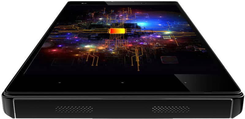 XOLO 8X-1000 tablet viewed from front angle, displaying colorful digital circuit board visualization on screen with glowing orange, blue, and yellow elements against dark background