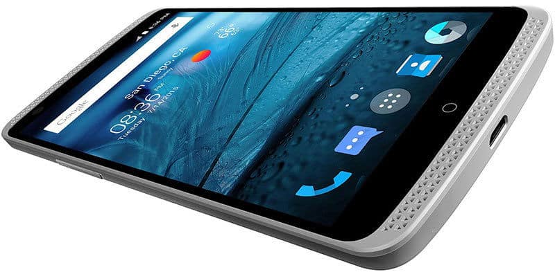 Front angled close-up of ZTE Axon Pro showing home screen, black front, and white textured edge.