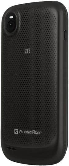 Rear view of black ZTE Render with perforated back, central ZTE logo, top left camera, and Windows Phone logo at bottom.