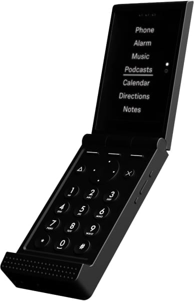 Light Flip foldable phone, open position, showing numeric keypad and display menu with Phone, Alarm, Music, Podcasts, Calendar, Directions, and Notes options