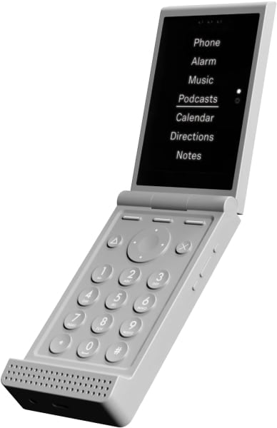 Light Flip open phone with numeric keypad and display showing menu options including Phone, Alarm, Music, Podcasts, Calendar, Directions, and Notes